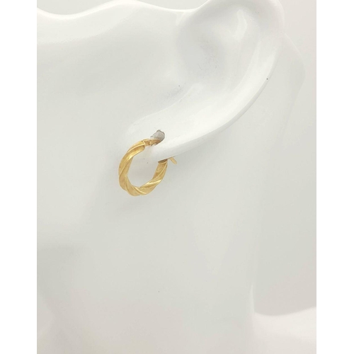 423 - A PAIR OF 9K GOLD TWIST HOOP EARRINGS  .   .9gms