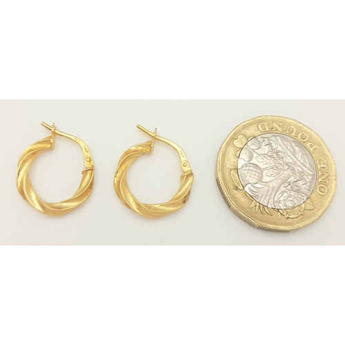 423 - A PAIR OF 9K GOLD TWIST HOOP EARRINGS  .   .9gms