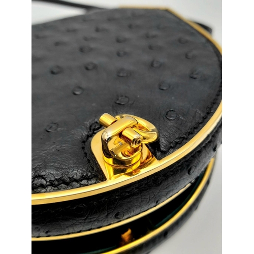 44 - An Asprey of London Black Ostrich Shoulder Bag. Comes with original Asprey box and mirror. Gilded ha... 