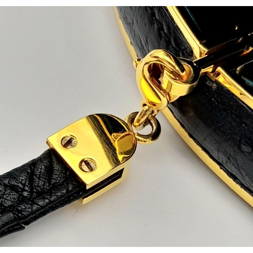 44 - An Asprey of London Black Ostrich Shoulder Bag. Comes with original Asprey box and mirror. Gilded ha... 