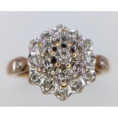 815 - A 9K YELOW GOLD DIAMOND RING IN THE FLORAL DESIGN 0.20CT 3.6G SIZE O.

SC 9003