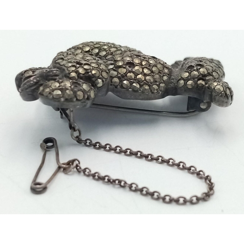 688 - AN ANTIQUE SOLID SILVER POODLE BROOCH WITH MARCASITE FINISH ,    29.7gms