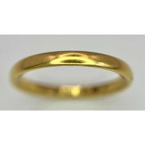 73 - A 22K GOLD BAND RING .   5.6gms   size T