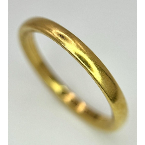 73 - A 22K GOLD BAND RING .   5.6gms   size T