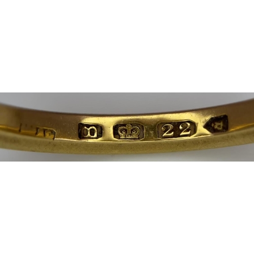 73 - A 22K GOLD BAND RING .   5.6gms   size T