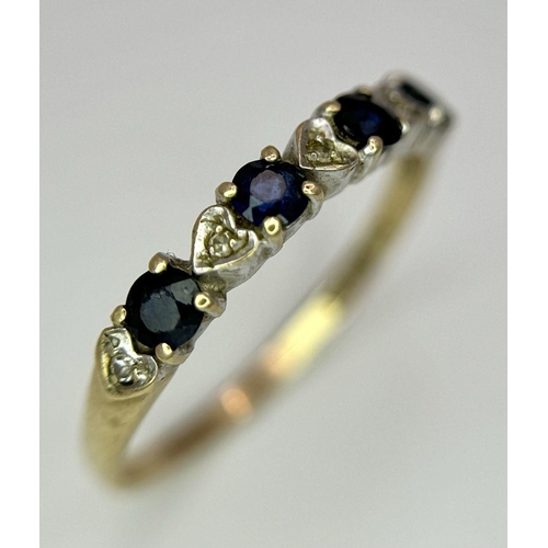 811 - A 9K GOLD RING WITH HEART SHAPED DIAMONDS AND SAPPHIRES.   1.2    size M