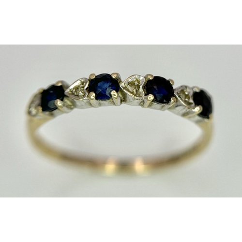 811 - A 9K GOLD RING WITH HEART SHAPED DIAMONDS AND SAPPHIRES.   1.2    size M