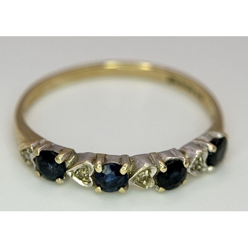 811 - A 9K GOLD RING WITH HEART SHAPED DIAMONDS AND SAPPHIRES.   1.2    size M