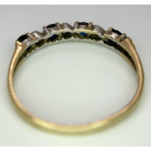 811 - A 9K GOLD RING WITH HEART SHAPED DIAMONDS AND SAPPHIRES.   1.2    size M