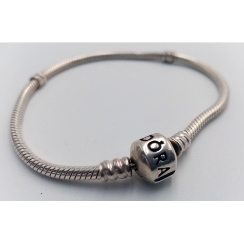 1255 - A PANDORA STERLING SILVER MOMENTS BRACELET 14.1G , approx 19cm length.

SC 9092