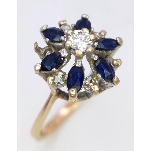 1258 - A 9K Yellow Gold Sapphire and Diamond Cluster Ring. One diamond missing. Size N, 2.23g total weight.