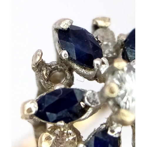 1258 - A 9K Yellow Gold Sapphire and Diamond Cluster Ring. One diamond missing. Size N, 2.23g total weight.