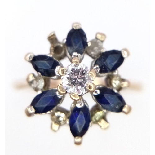 1258 - A 9K Yellow Gold Sapphire and Diamond Cluster Ring. One diamond missing. Size N, 2.23g total weight.