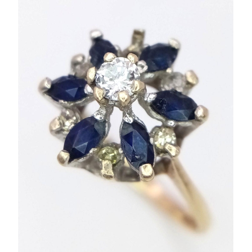 1258 - A 9K Yellow Gold Sapphire and Diamond Cluster Ring. One diamond missing. Size N, 2.23g total weight.