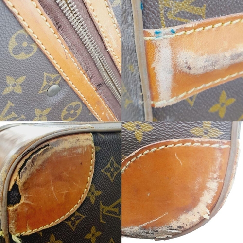 17 - A Louis Vuitton Vintage Large Suitcase. Monogrammed canvas exterior with leather trim, gold-toned ha... 