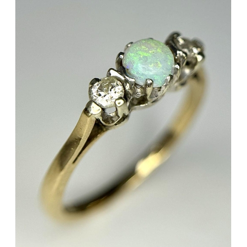 220 - A 9k Yellow Gold Opal and Diamond Ring. Central colour play opal with a brilliant round cut diamond ... 