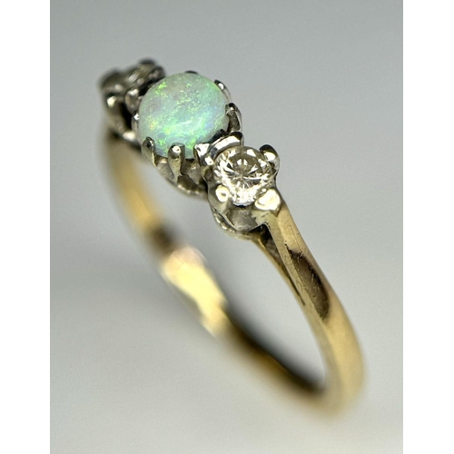 220 - A 9k Yellow Gold Opal and Diamond Ring. Central colour play opal with a brilliant round cut diamond ... 