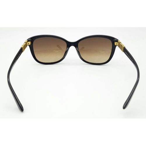 309 - A Pair of Designer Versace Black Sunglasses. White stone and logo embellishment to side frames. Come... 