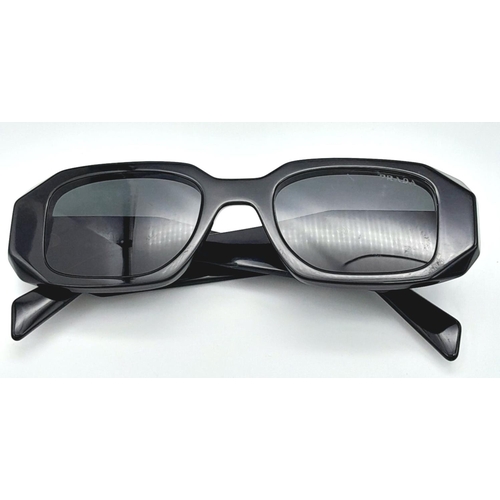 353 - A Pair of Designer Prada Black Sunglasses.