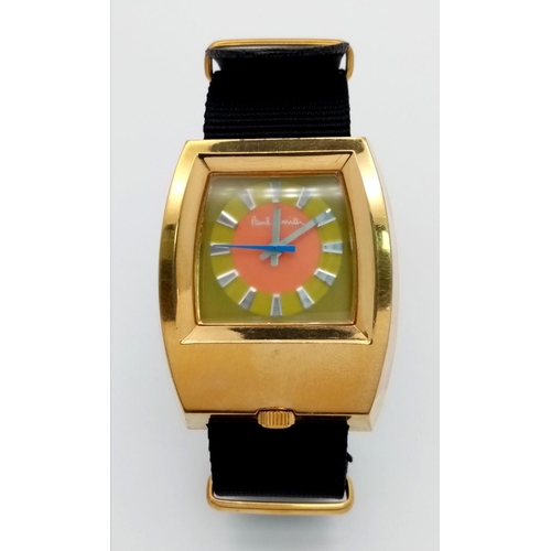 354 - A Paul Smith Designer Automatic Gents Watch. Textile strap. Gilded case -37mm. Multi colour dial. In... 