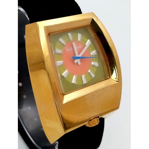 354 - A Paul Smith Designer Automatic Gents Watch. Textile strap. Gilded case -37mm. Multi colour dial. In... 