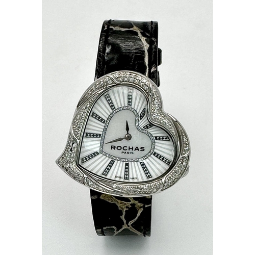 368 - A Rochas of Paris Diamond Ladies Quartz Watch. Black leather strap. Heart shaped case - 36mm. Mother... 