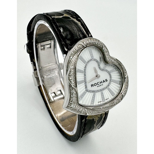 368 - A Rochas of Paris Diamond Ladies Quartz Watch. Black leather strap. Heart shaped case - 36mm. Mother... 