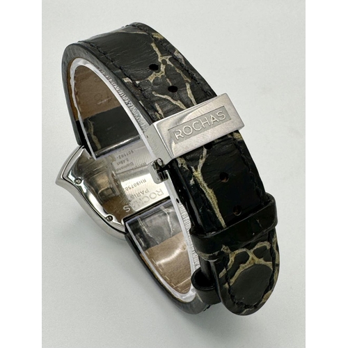 368 - A Rochas of Paris Diamond Ladies Quartz Watch. Black leather strap. Heart shaped case - 36mm. Mother... 