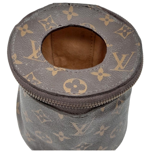 37 - A Louis Vuitton Toilet Paper/Tissue Holder. Monogrammed canvas exterior with gold-toned hardware and... 