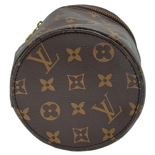 37 - A Louis Vuitton Toilet Paper/Tissue Holder. Monogrammed canvas exterior with gold-toned hardware and... 