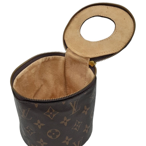 37 - A Louis Vuitton Toilet Paper/Tissue Holder. Monogrammed canvas exterior with gold-toned hardware and... 