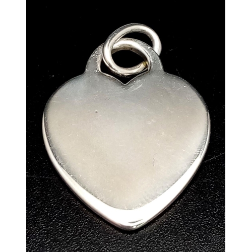 386 - A Tiffany and Co Sterling Silver Heart Pendant. 3cm.