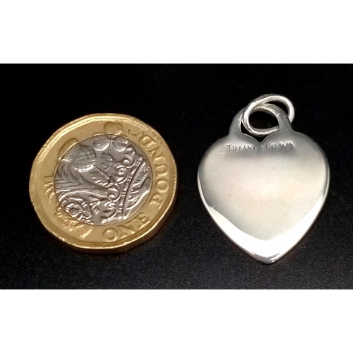 386 - A Tiffany and Co Sterling Silver Heart Pendant. 3cm.