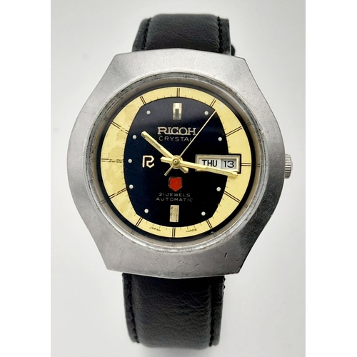 422 - A Vintage Ricoh Automatic Gents Watch. Black leather strap. Stainless steel case - 38mm. Black/yello... 