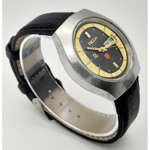 422 - A Vintage Ricoh Automatic Gents Watch. Black leather strap. Stainless steel case - 38mm. Black/yello... 