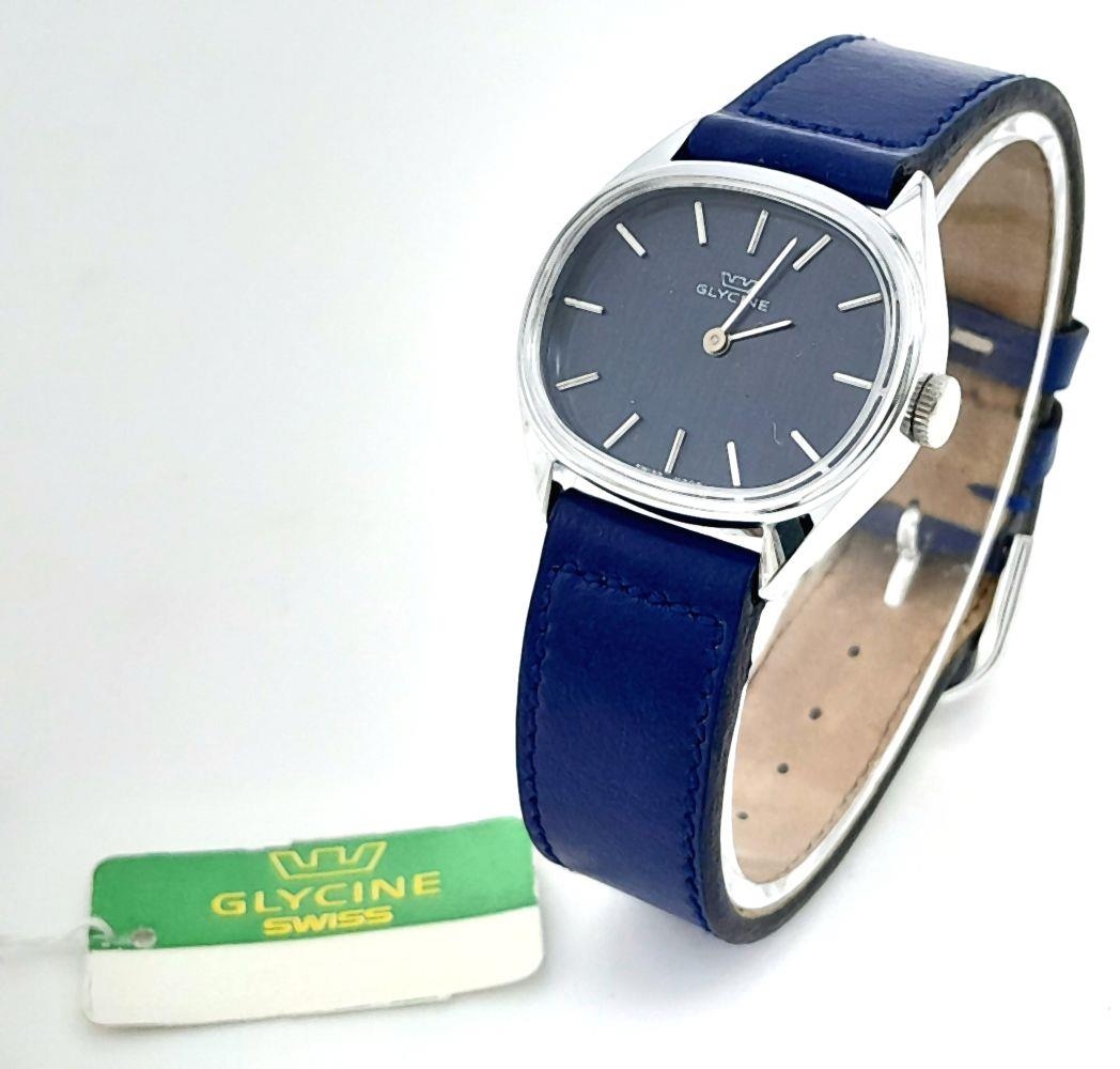 A Glycine Swiss Mechanical Ladies Watch. Blue leather strap. Oval ...