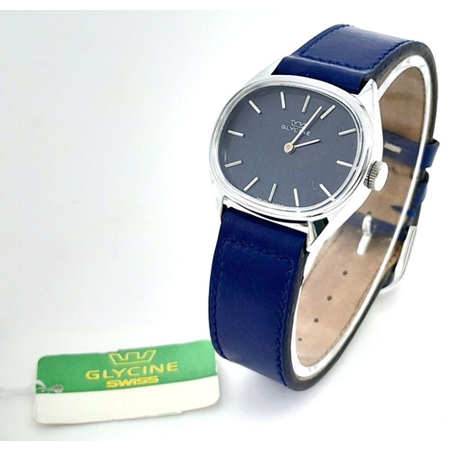 A Glycine Swiss Mechanical Ladies Watch. Blue leather strap. Oval ...