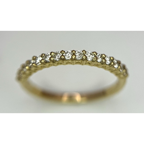 484 - A 9K Yellow Gold Half Eternity Diamond Ring. Size M/N, 1.57g total weight.