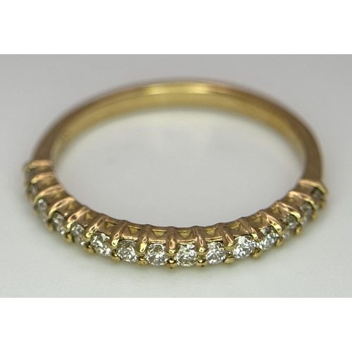 484 - A 9K Yellow Gold Half Eternity Diamond Ring. Size M/N, 1.57g total weight.