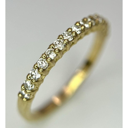 484 - A 9K Yellow Gold Half Eternity Diamond Ring. Size M/N, 1.57g total weight.