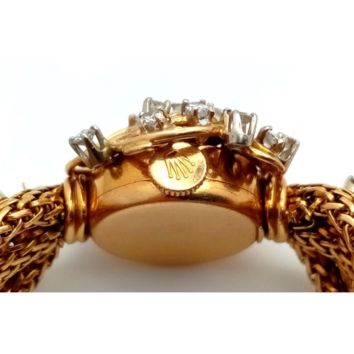 51 - A VINTAGE 18K GOLD AND DIAMOND LADIES ROLEX DRESS WATCH . A WOVEN 18K GOLD STRAP COMPLIMENTED BY A H... 