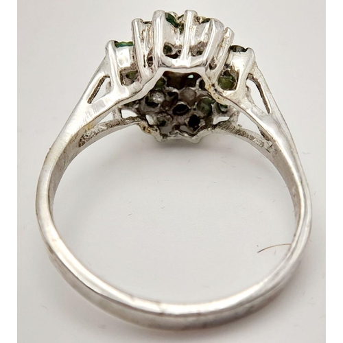 513 - A Sterling Silver Emerald Cluster Ring. Ring size W 1/2. Total weight: 5.92g.

ref: HV 2304