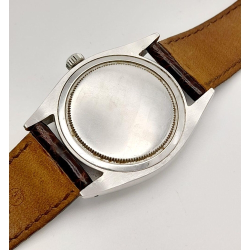 57 - A Vintage Rolex Precision Mechanical Gents Watch. Brown leather strap. Stainless steel case - 34mm. ... 