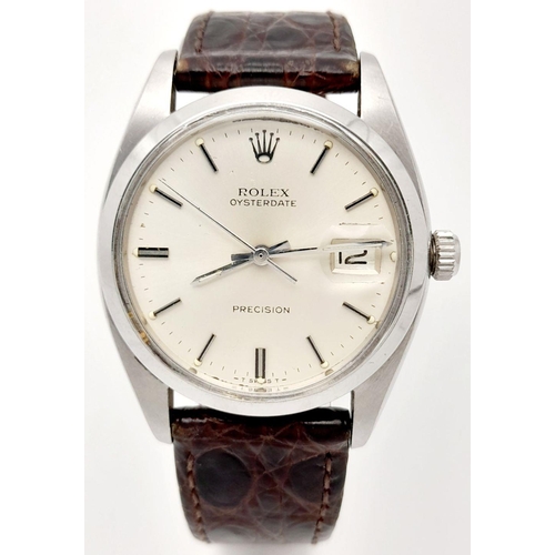 57 - A Vintage Rolex Precision Mechanical Gents Watch. Brown leather strap. Stainless steel case - 34mm. ... 