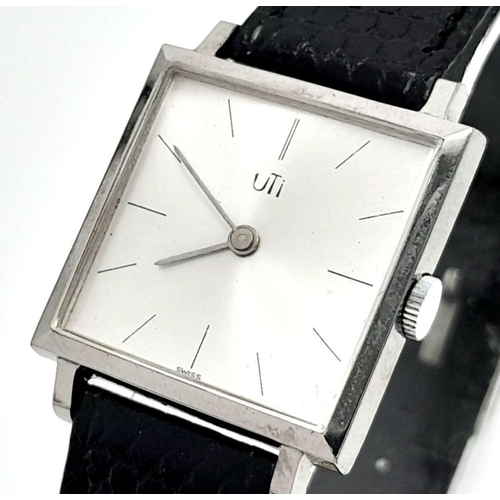 577 - A Vintage Uti Mechanical Ladies Watch. Black leather strap. Stainless steel thin case - 26mm. Silver... 