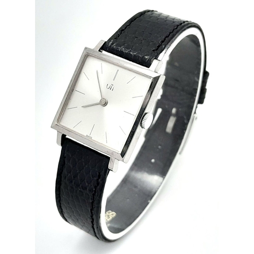 577 - A Vintage Uti Mechanical Ladies Watch. Black leather strap. Stainless steel thin case - 26mm. Silver... 