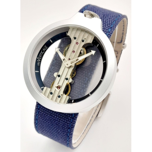 618 - A Verticale Mechanical Top Winder Gents Watch. Blue denim strap. Ceramic silver tone skeleton case -... 