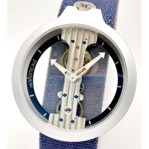 618 - A Verticale Mechanical Top Winder Gents Watch. Blue denim strap. Ceramic silver tone skeleton case -... 