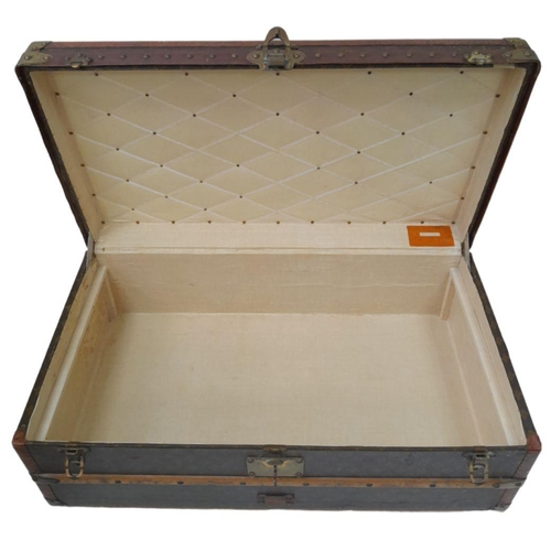 79 - An Antique Louis Vuitton Monogram Steamer Trunk. Features: Solid brass corners, locks and handles. I... 