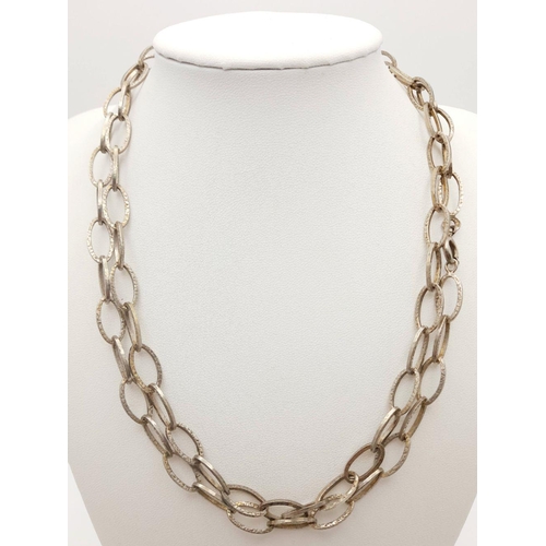 803 - A Silver Chain Link Necklace. 92cm length, 43.29g weight.